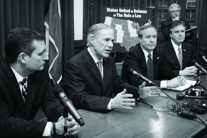 From left, Sen. Ted Cruz, Gov. Greg Abbott, Attorney General Ken Paxton and Lt. Gov. Dan Patrick talk about President Obama's immigration executive order at a news conference at the Capitol on Wednesday Feb. 18, 2015 in Austin, Texas. (Jay Janner/Austin American-Stateman/TNS)