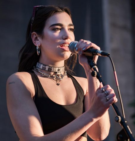 Pop star Dua Lipa performing one of her songs on stage